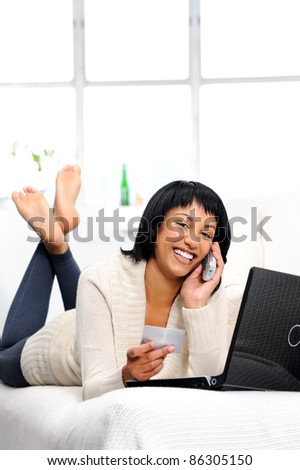 Woman is happy to be connected remotely to her bank details via phone and the internet