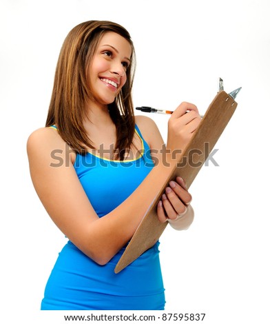 attractive young woman writes with a clipboard. researcher, survey or student taking notes.