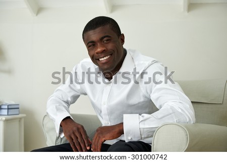 portrait of professional smart african black business man sitting at home