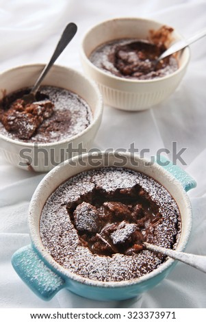 Molten lava chocolate cake dessert self saucing pudding baked in individual cups