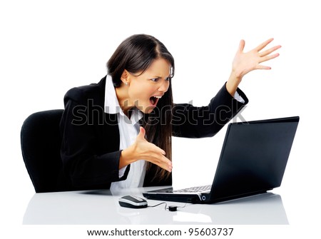 businesswoman working at her desk with laptop computer is stressed, frustrated and overwhelmed by depressing business situations. isolated on white