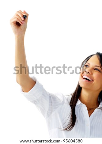 Laughing woman in white blouse stretches her arm to write, isolated on white