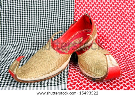 Arabic slippers on arabic background.