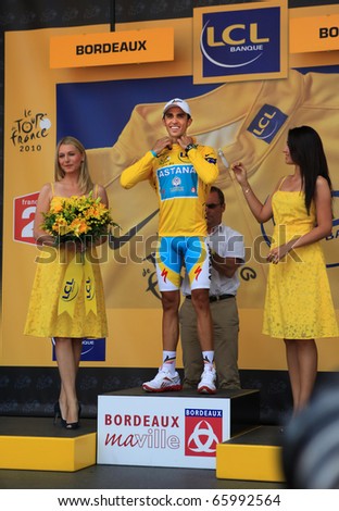 BORDEAUX, FRANCE - JULY 23: Cyclist Alberto Contador wears the yellow jersey and stands on the podium after the 18th stage of Tour de France 2010 on July 23, 2010 Tour de France in Bordeaux, France.
