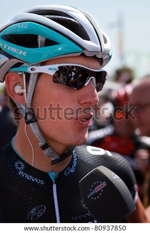 PASSAGE DU GOIS, FRANCE - JULY 2: Andy Schleck is giving interview before start of 1st stage of Tour de France 2011, July 2, 2011 Tour de France in Passage du Gois.