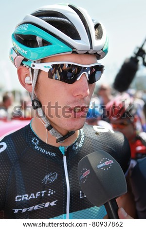 PASSAGE DU GOIS, FRANCE - JULY 2: Andy Schleck is giving interview before start of 1st stage of Tour de France 2011, July 2, 2011 Tour de France in Passage du Gois.