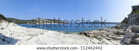 panoramic view of a beautiful rocky beach in croatia, blue sea