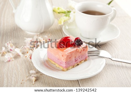 beautiful pink berries pastry, little cake with tea
