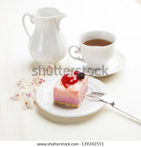 beautiful pink berries pastry, little cake with tea