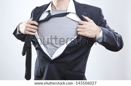 Closeup Of A Businessman Showing The Superhero Suit Under His Shirt