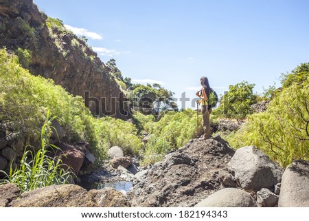 young woman hiking in tropical nature