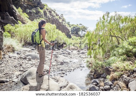 young woman hiking in tropical nature