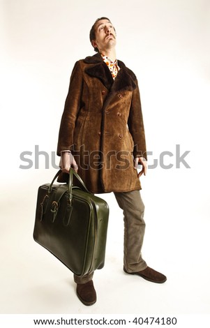 funny vintage young man with suitcase