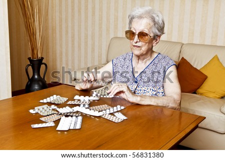 elder woman with pills