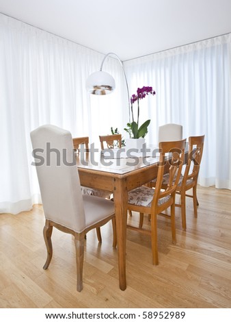 modern dining room with white curtains