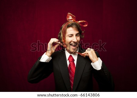 young funny guy with red ribbon on the head