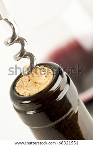 macro close up of corkscrew in wine bottle cork
