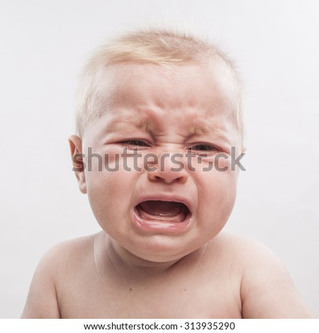 portrait of a cute newborn baby crying