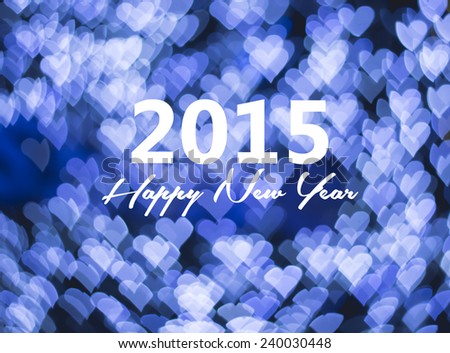 Happy new year card, blue heart bokeh background