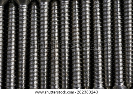 Set of lSet of long screws as industrial backgroundong screws as industrial background