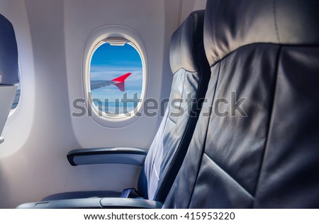 empty seat  airplane and window view inside an aircraft