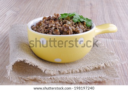 mushrooms finely chopped lying in the ceramic ware