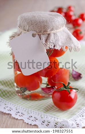 net unfilled tag hanging on the bank with canned tomatoes