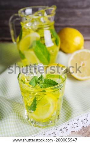 cooling drink yellow with ice and mint
