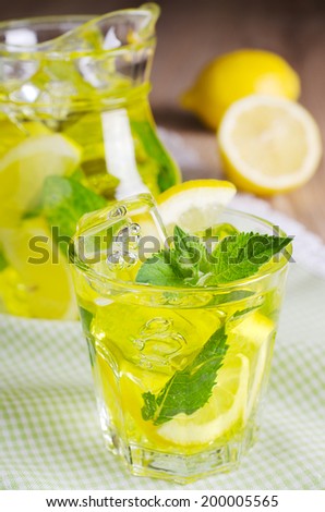 cooling drink yellow with ice and mint
