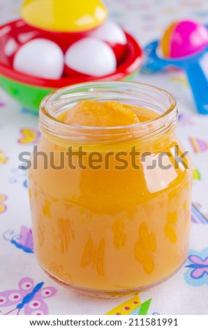 Baby food orange color in the glass open bank