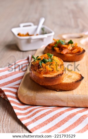 Cooked with finely chopped pieces of pumpkin are on toasted bread