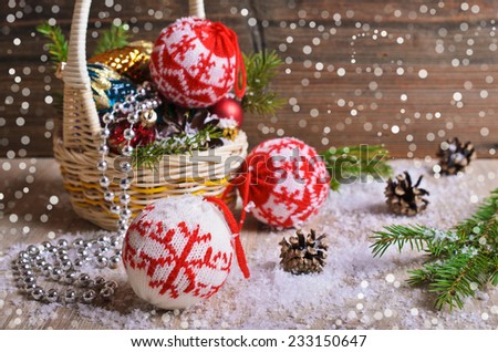 Christmas composition with ornaments, pine cones, branches of fir trees and artificial snow