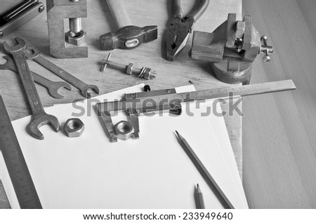 Various tools and mechanical devices on the white blank sheets for recording