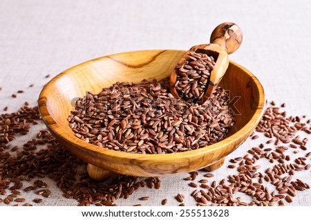 Brown unpolished rice in wooden bowl