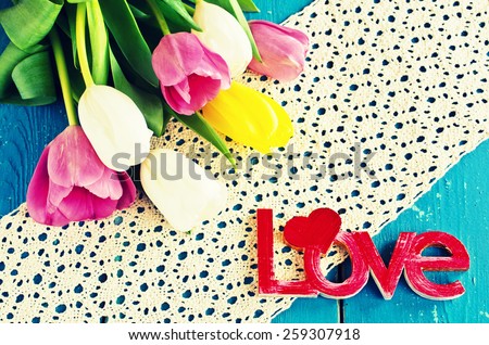 Tulips of different colors and the words \