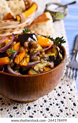 Lentils cooked with capsicum, eggplant and onions