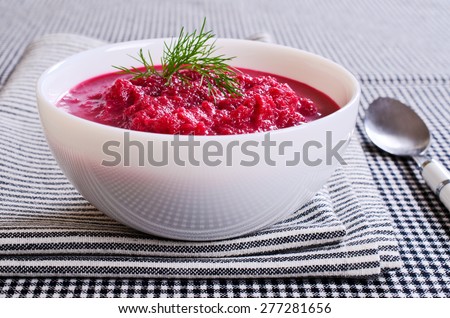 Soup of pureed red beets in a ceramic plate
