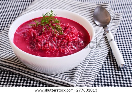 Soup of pureed red beets in a ceramic plate