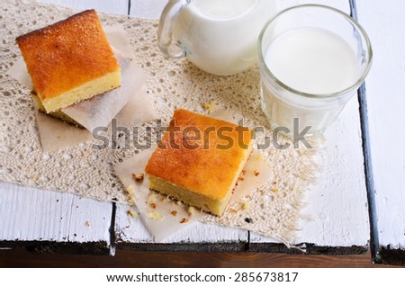 Piece of sweet sponge cake on paper in rustic style