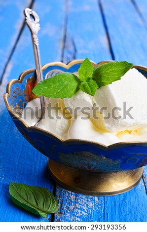 Ice cream white with mint leaves in metal ware
