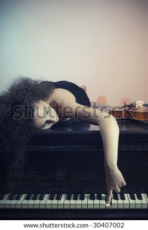 Young and beautiful girl feel the passion of  love with music of a grand piano in background