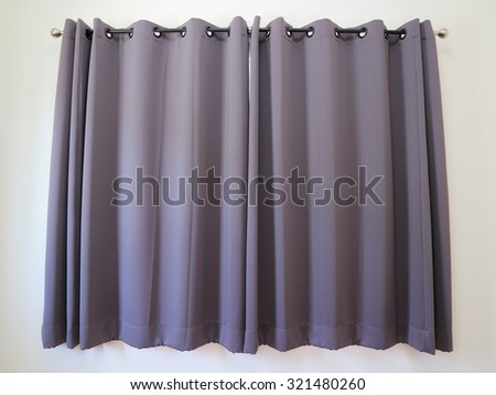 purple colored curtains In steel rail