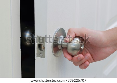 hand open the white door