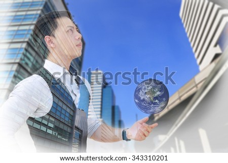 Double exposure of businessman with building, sky and earth, filter by sepia tone, Elements of this image furnished by NASA