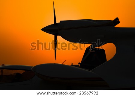 silhouette of airplane engine on sunset