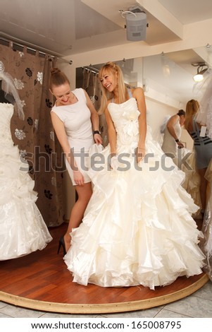 A Bride-To-Be shopping for a wedding dress in a Bridal Boutique.