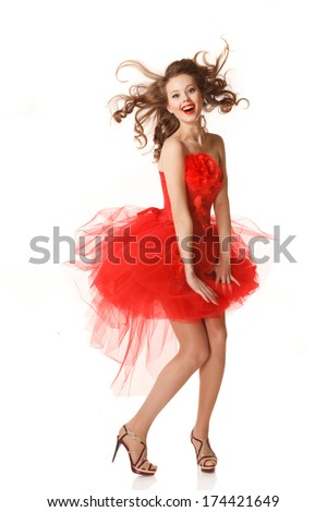 Pin up girl in red dress with flying hair.Professional make-up, hair and style