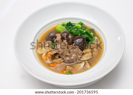 Fried noodle with beef , shiitake and chinese kale in gravy
