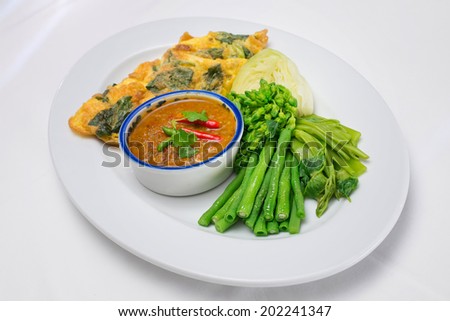 Chilli sauce of catfish eaten with vegetables and thai basil omelet (Thai cuisine)