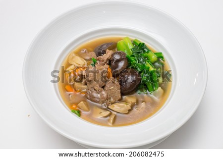 Fried noodle with beef , shiitake and chinese kale in gravy